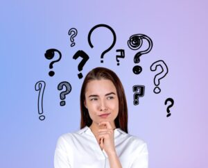 Thoughtful young woman with question marks around her head