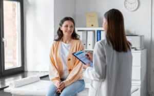 Smiling woman visiting her doctor for a checkup