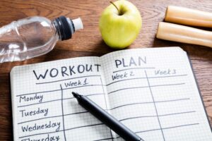 Workout plan written in notebook